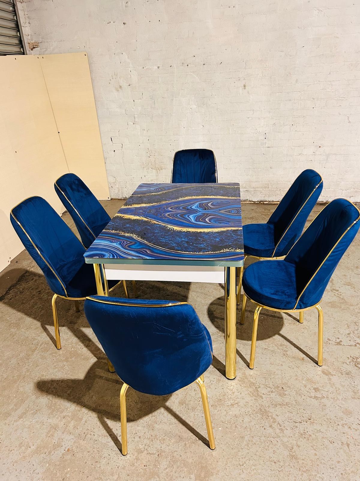 Gold frame dining table with velvet chairs