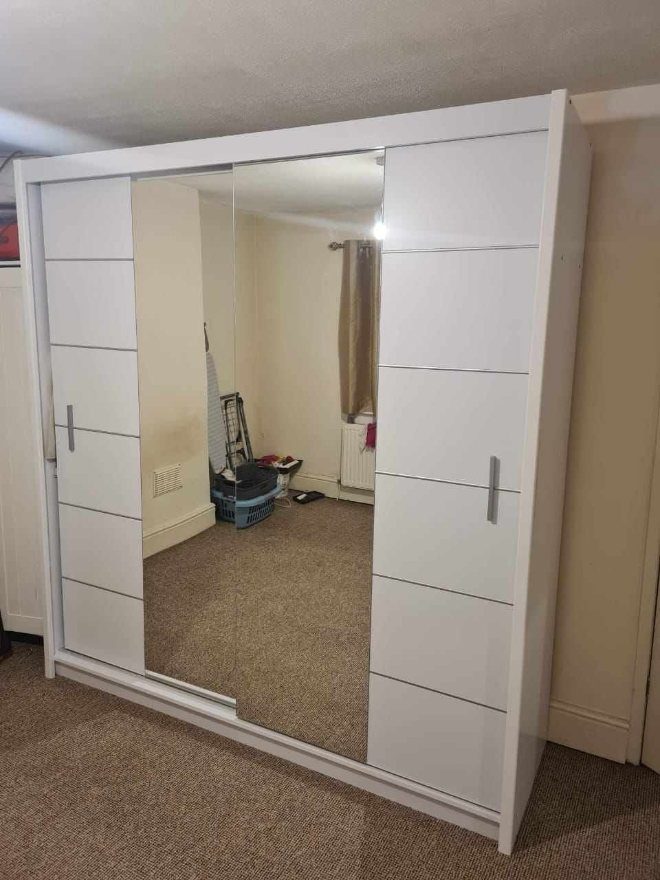 White sliding mirror wardrobe from Kensley Home
