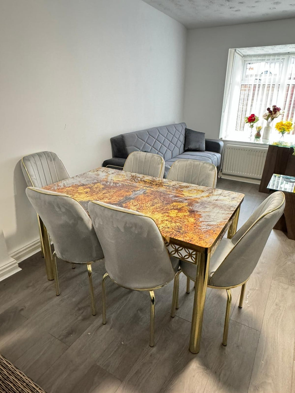 Anka Gold marble-effect dining table (table only) from Kensley Home