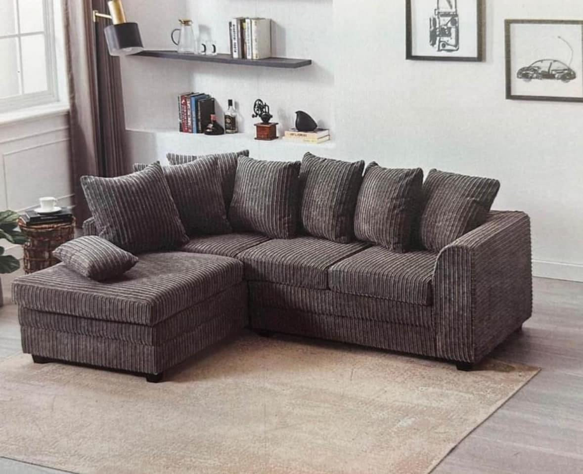 Charcoal jumbo cord Dylan corner sofa with scatter-back cushions in a living room