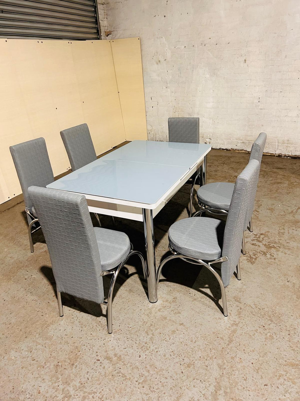 Extendable Glass Dining Table with 6 Chairs in full grey from Kensley Home