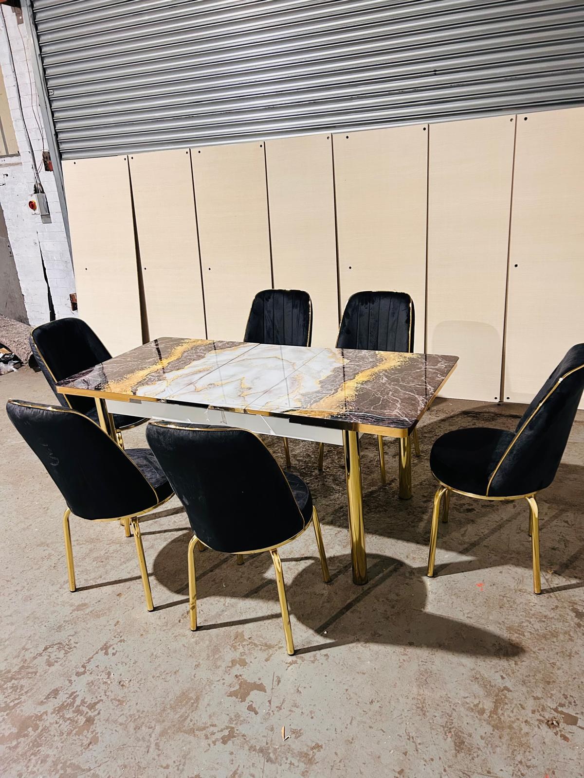Gold Frame Extendable Dining Table with 6 Chairs in black & golden sand from Kensley Home
