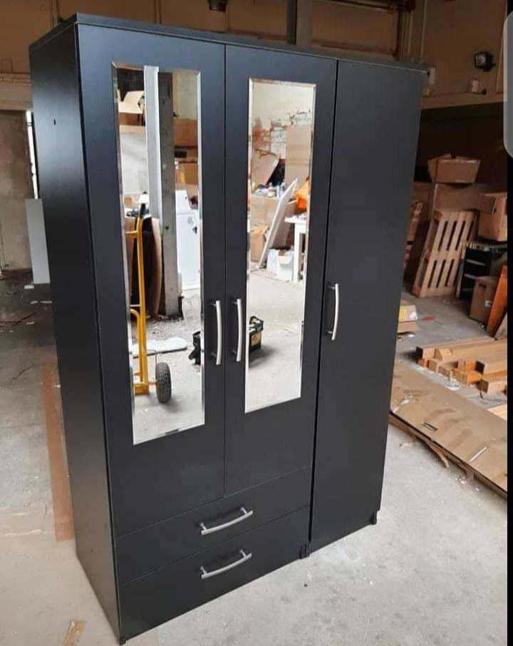Black 4-door wardrobe with two mirror doors and drawers