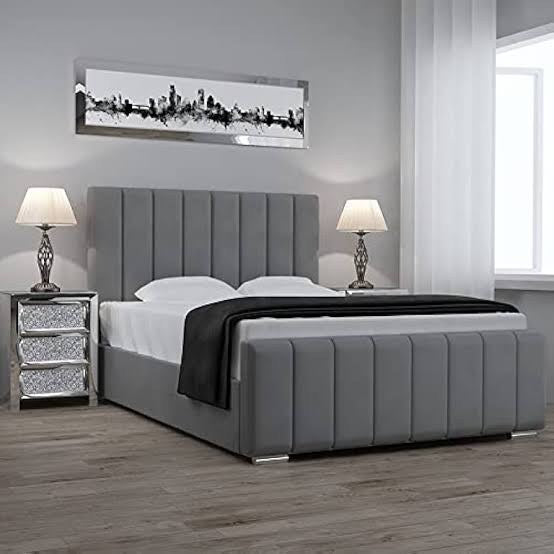 Grey velvet Panel Line Bed with black throw in a styled bedroom