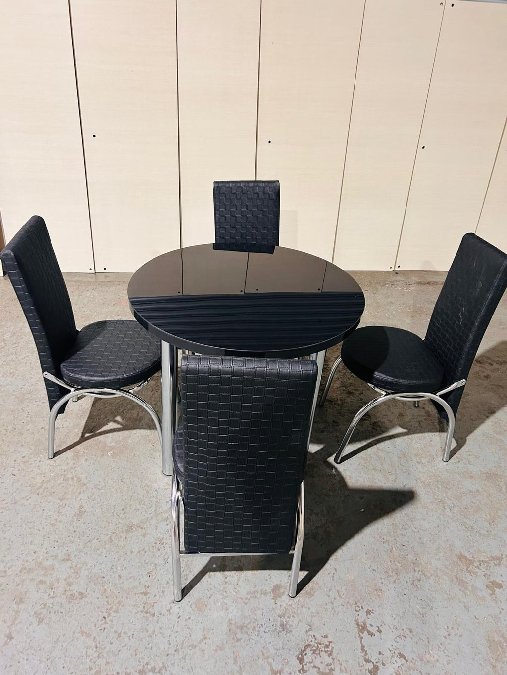 Round Glass Dining Table with 4 Chairs in full black from Kensley Home