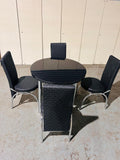 Round Glass Dining Table with 4 Chairs in full black from Kensley Home