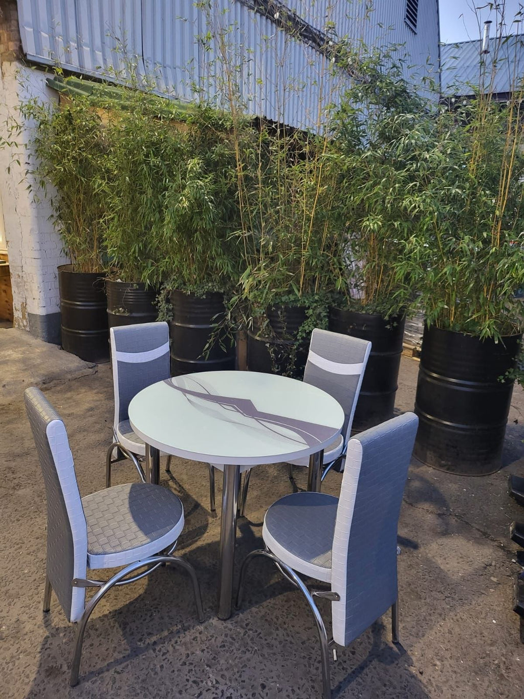 Round Glass Dining Table with 4 Chairs in grey wave from Kensley Home