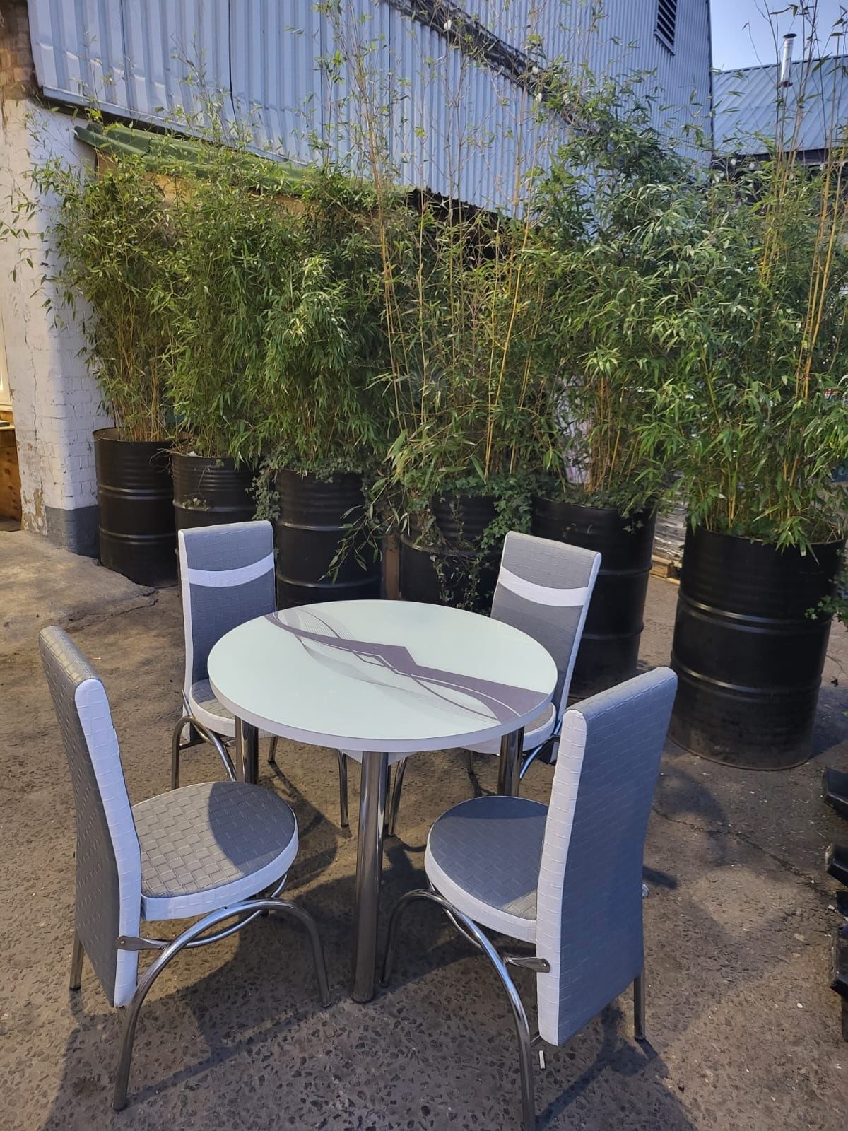 Round Glass Dining Table with 4 Chairs in grey wave from Kensley Home