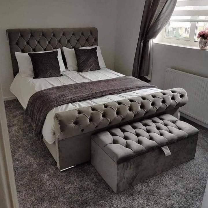 Grey velvet chesterfield Sleigh Bed with scrolled footboard and matching ottoman