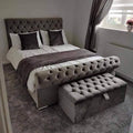 Grey velvet chesterfield Sleigh Bed with scrolled footboard and matching ottoman