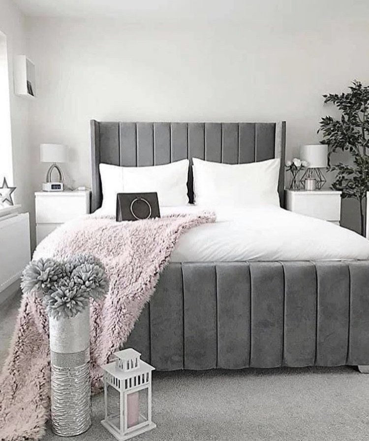 Grey velvet Wingline Panel Bed with tall winged headboard in a bright bedroom
